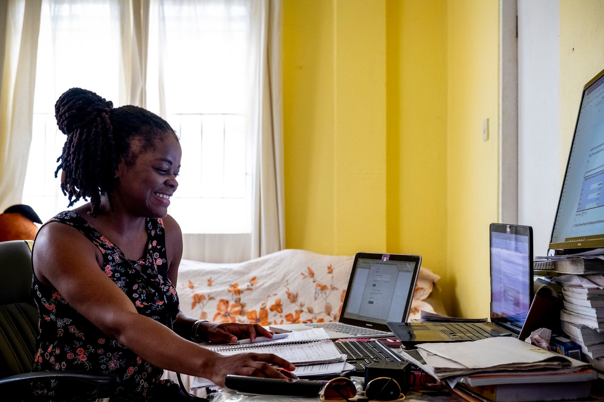 Woman working on laptop sitting at a desk 