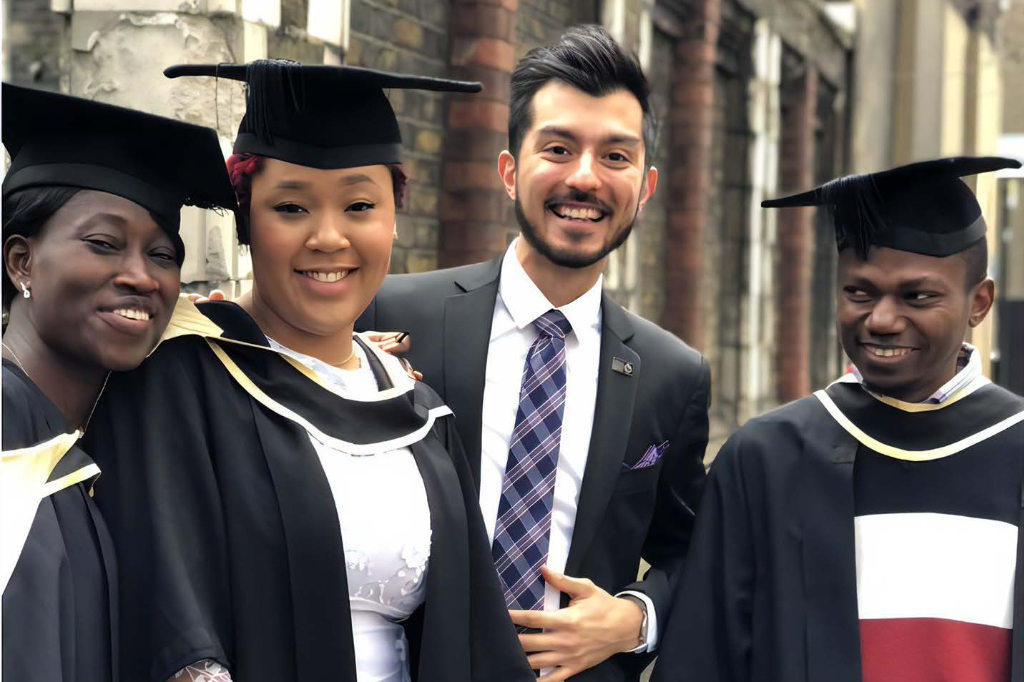 Graduates of the master's course gather in their caps and gowns 