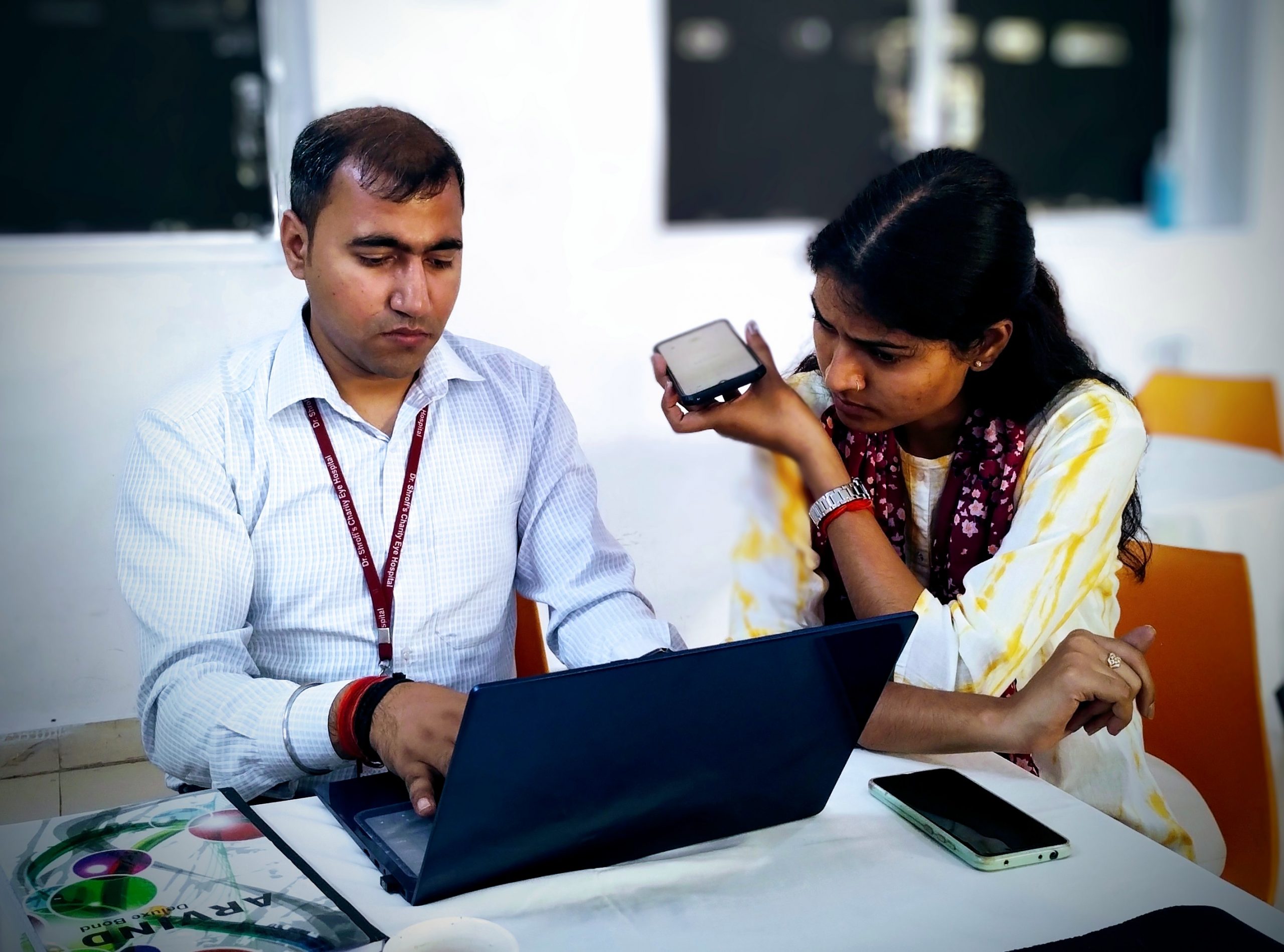 IMG_20240418_165509365~2 In India two health workers use a laptop and phone
